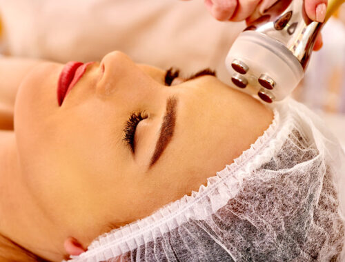 48936562 - close up of head woman receiving electroporation  facial therapy at beauty salon.